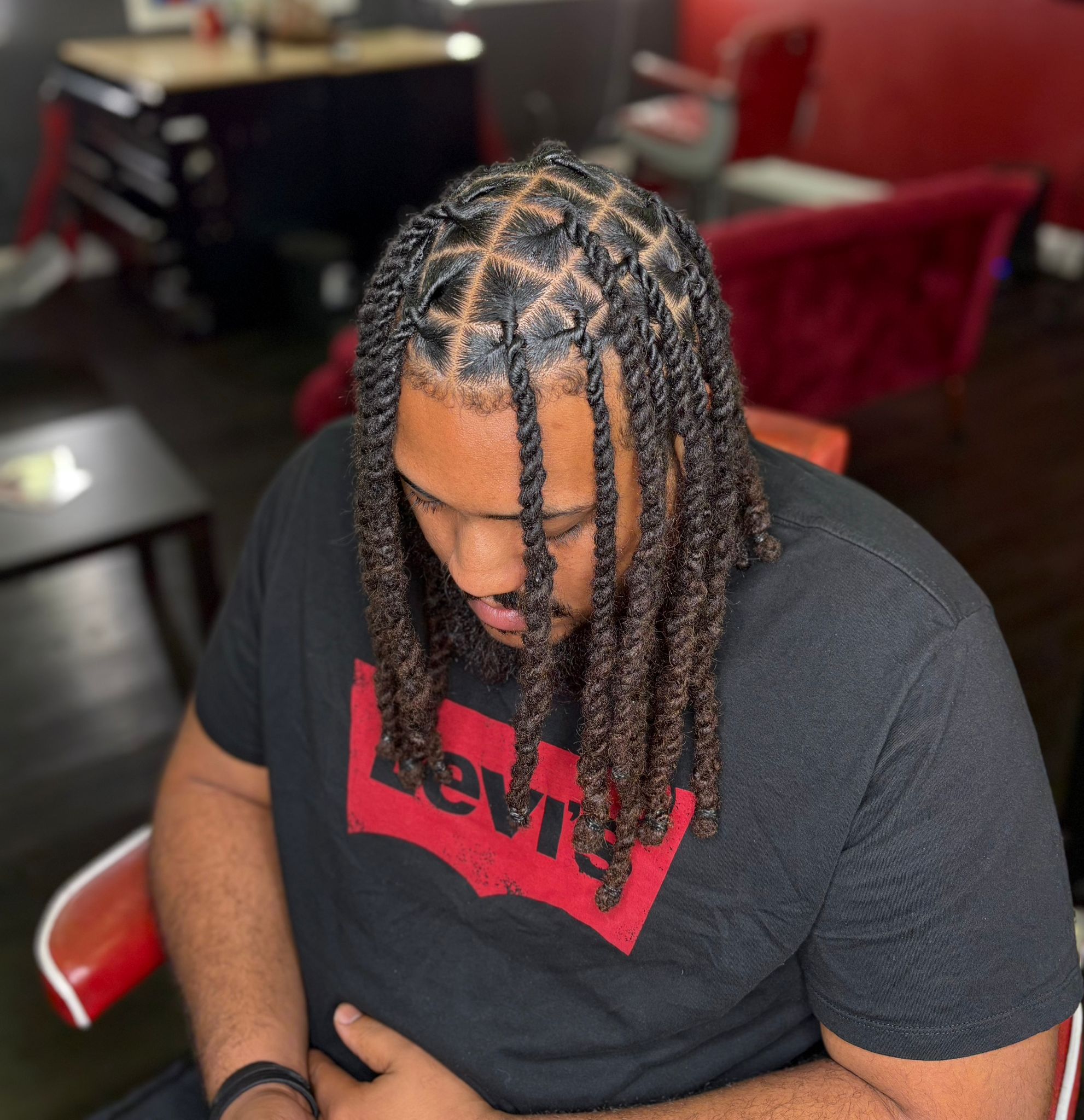 Copper-colored locs with a tapered shape